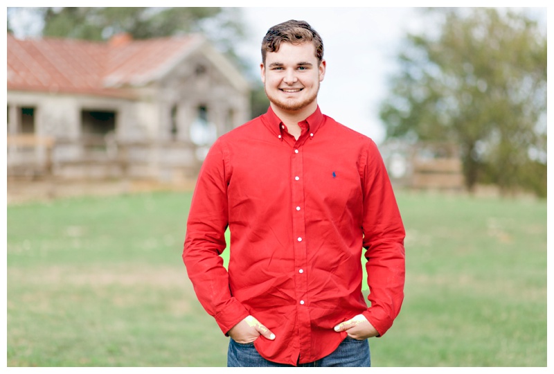 Guy Senior Portrait with barn at Berry Springs Park in Georgetown, Texas