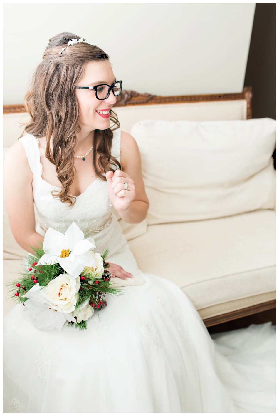 classy bride sitting with pointsettia bouquet