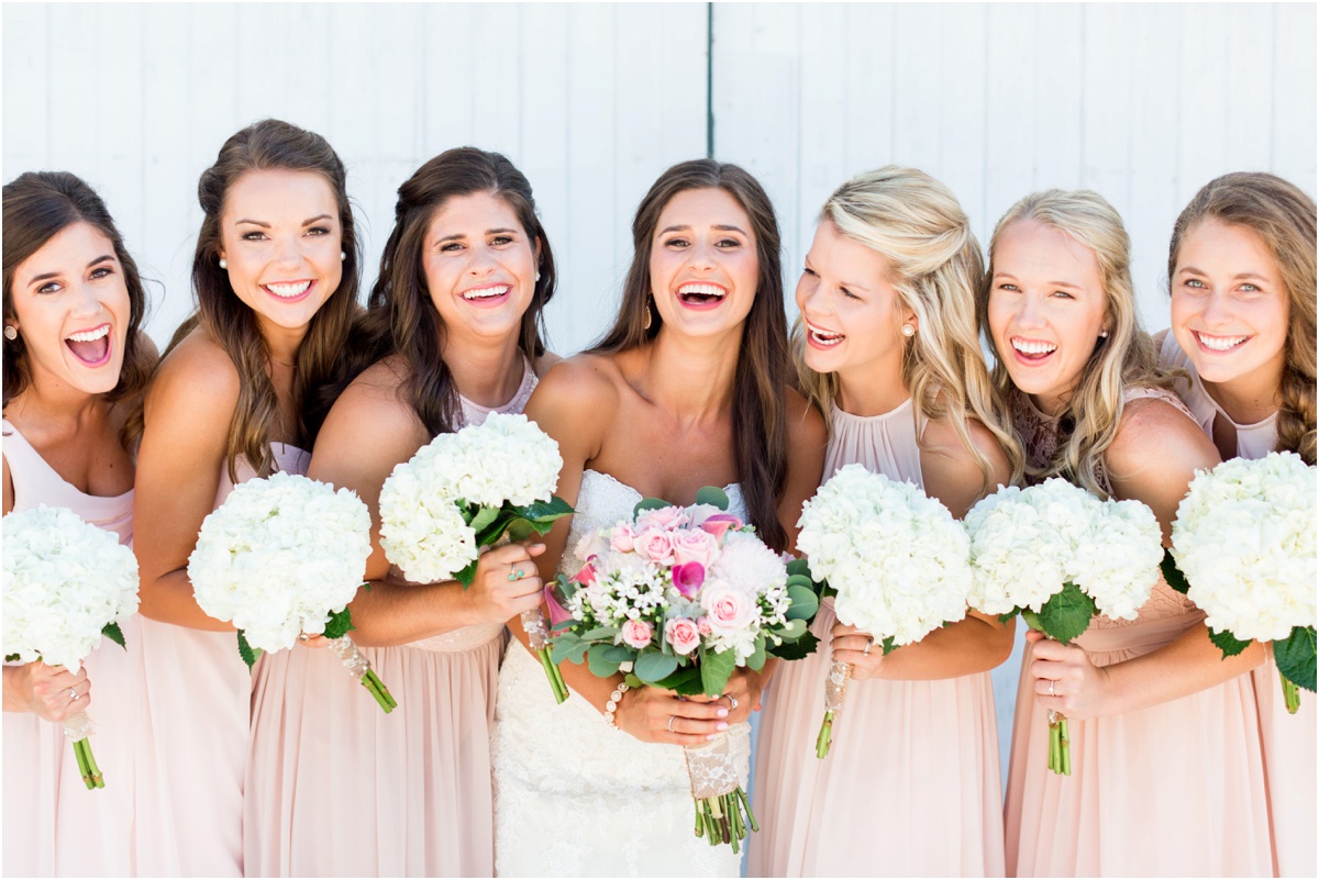 bridesmaids in long blush dresses