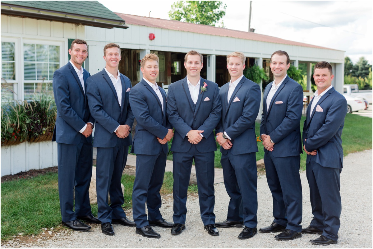 groomsmen in navy suits