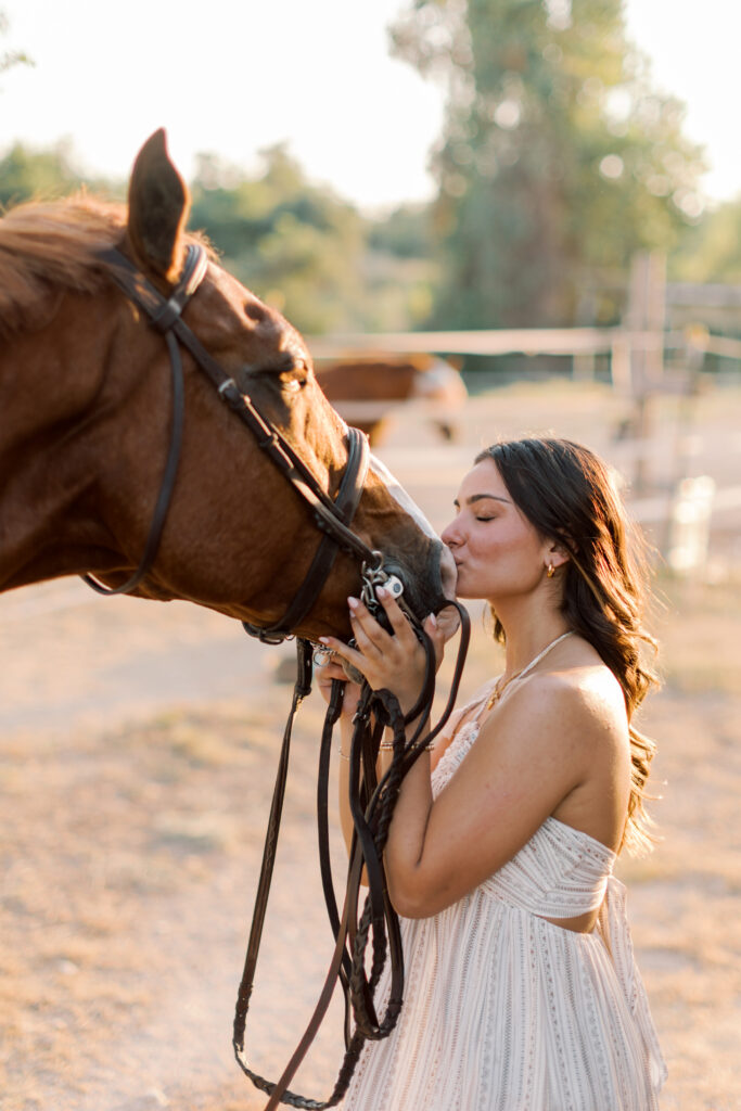 Close crop of senior with her horse in golden hour – artistic and modern equestrian portrait.