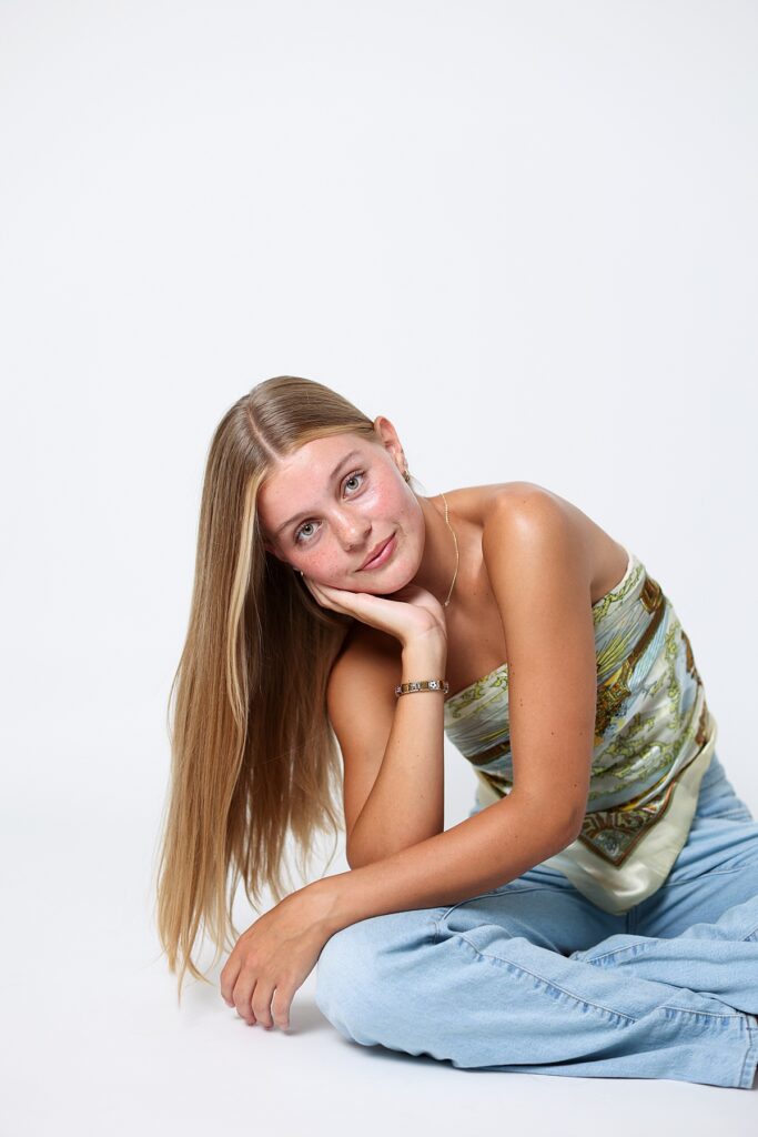 Natural studio headshot of resting her face on her hand, captured in Malibu Southern California