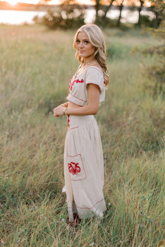 Southern California senior portrait with dreamy sunset light and tall grass