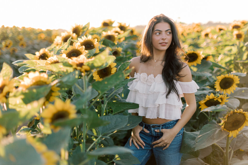Westlake High School senior portrait in a sunflower field near Westlake Village photographed by a Thousand Oaks senior photographer