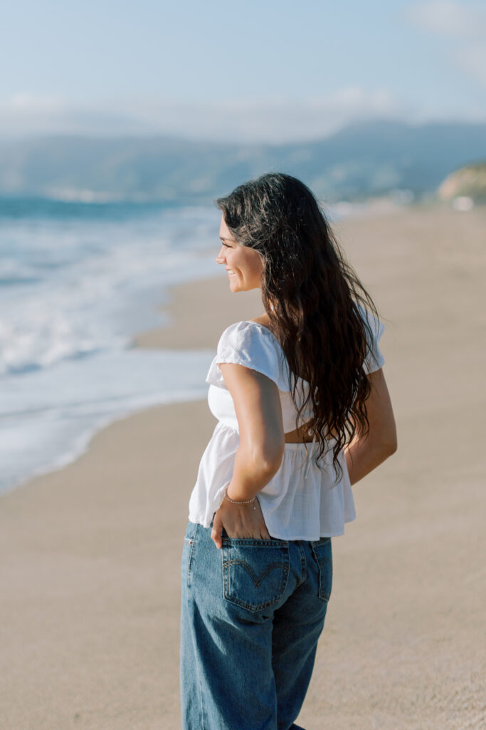 high school senior side profile looking toward ocean at Malibu beach, natural light senior photos Point Dume Southern California photographer