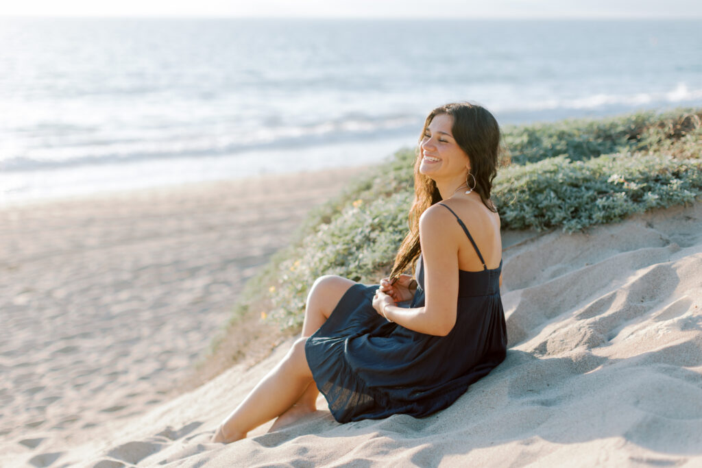 high school senior close up at Westward Beach Malibu touching hair and smiling, natural light beach portrait Thousand Oaks senior photographer