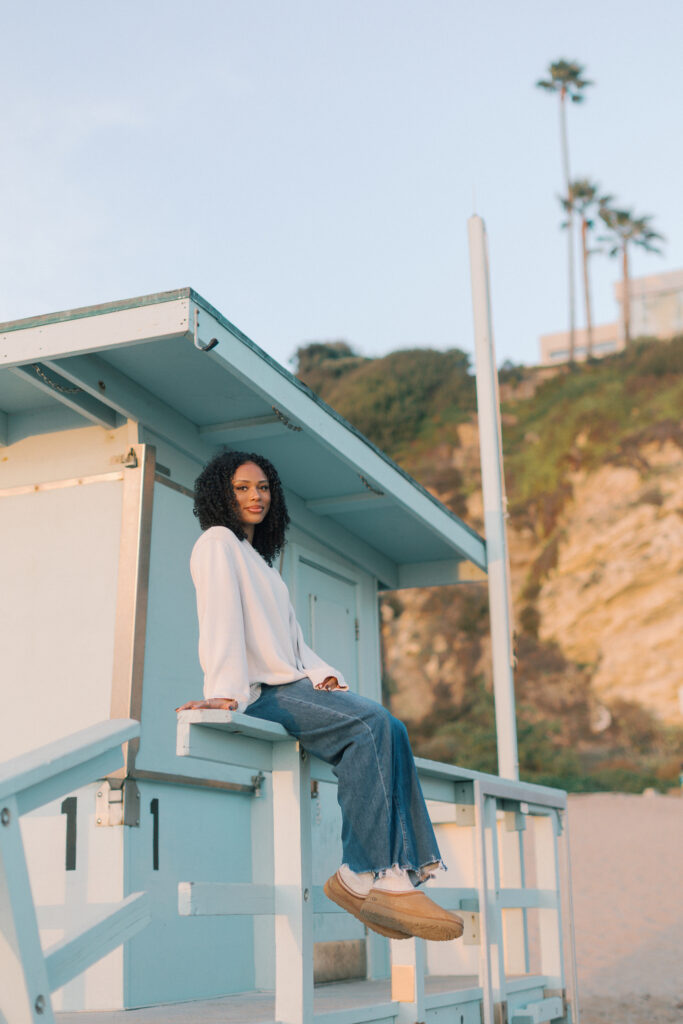 Malibu senior photos at Point Dume lifeguard stand featuring Oaks Christian senior in natural golden hour light