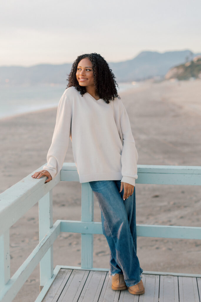 Oaks Christian High School senior portrait at Point Dume Malibu with soft sunset light and beach scenery