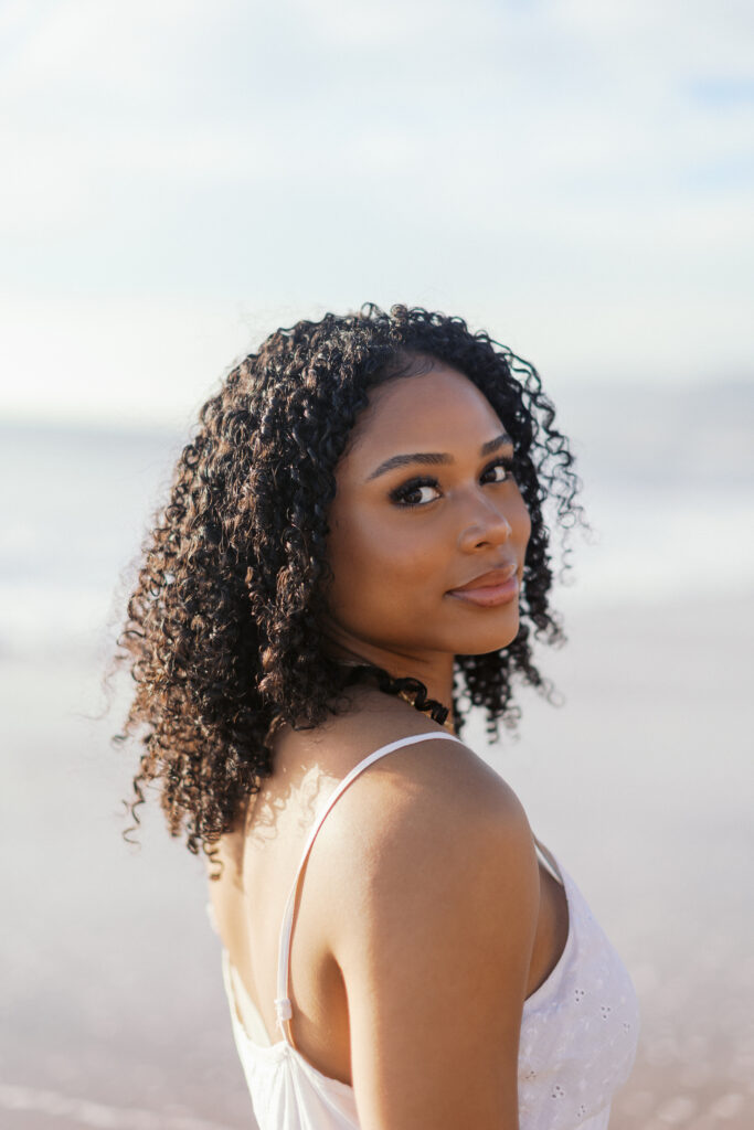 Oaks Christian senior portrait at Westward Beach Malibu featuring close-up natural light and beach background