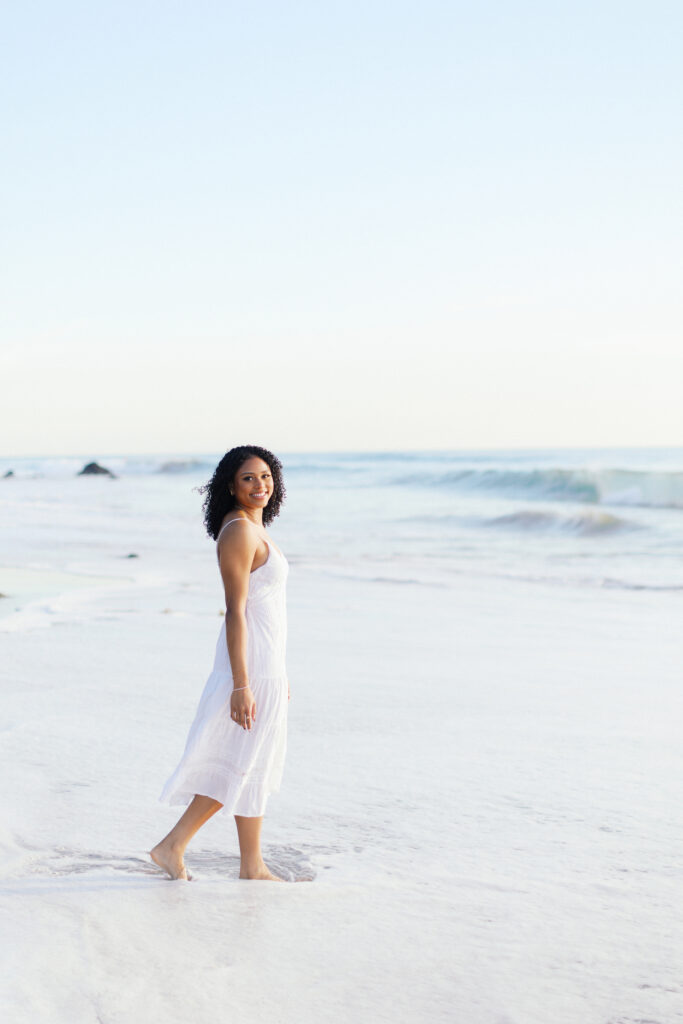 Oaks Christian senior photos at Westward Beach Malibu with soft waves and natural light along the coastline