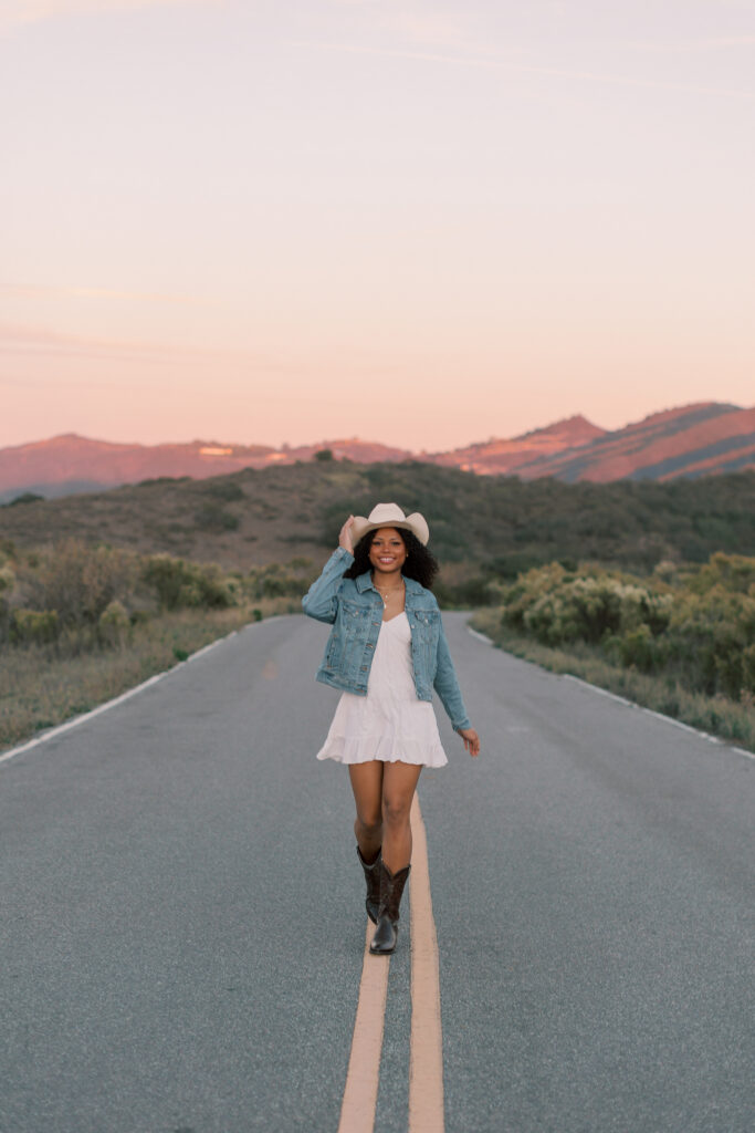 Thousand Oaks senior photos on a scenic mountain road in the Santa Monica Mountains with golden hour light
